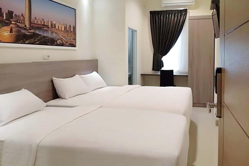 Twospaces Living At Maximus Inn Palembang Dış mekan fotoğraf