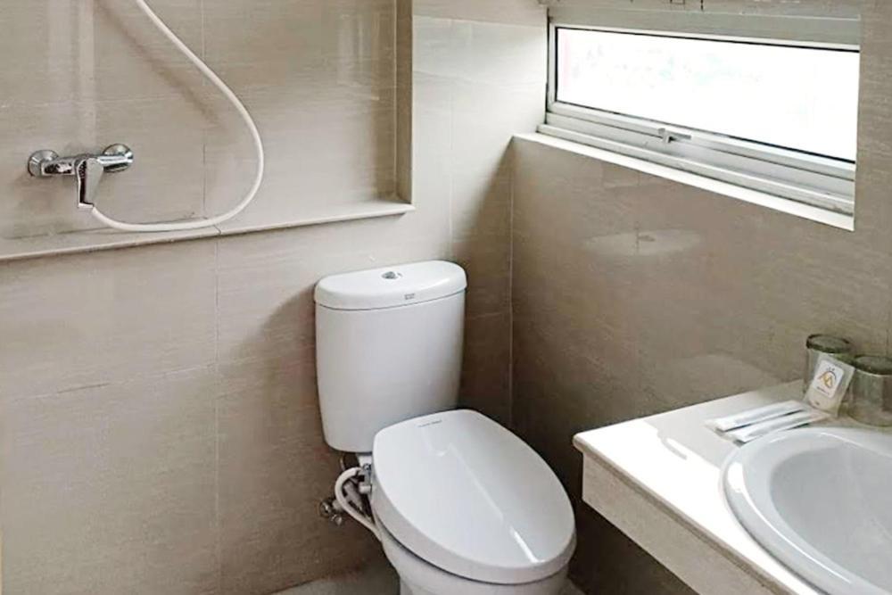 Twospaces Living At Maximus Inn Palembang Dış mekan fotoğraf